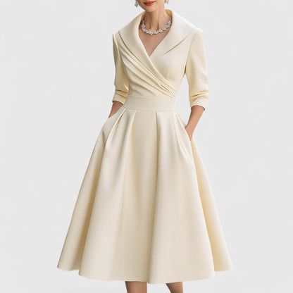 Vestido midi cruzado con escote en V y bolsillos | Manga tres cuartos